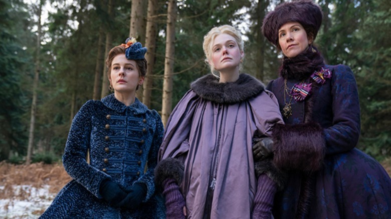 Three women outside heavy clothes