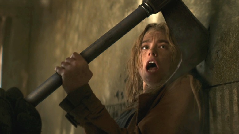 Supergirl nearly missing an axe to the head in Supergirl