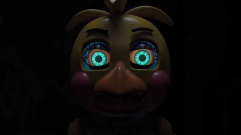Chica staring out of the darkness in Five Nights at Freddy's 2
