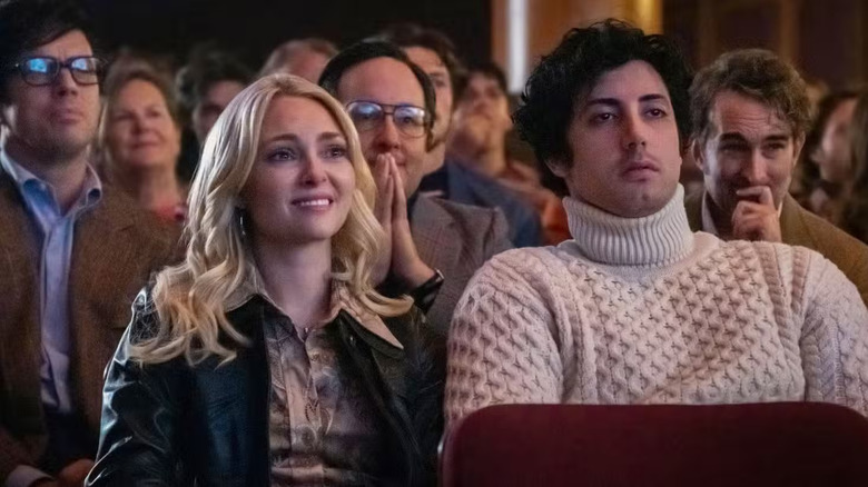Robert Chartoff, Irwin Winkler, and John G. Avildsen sit behind Sasha and Stallone in I Play Rocky