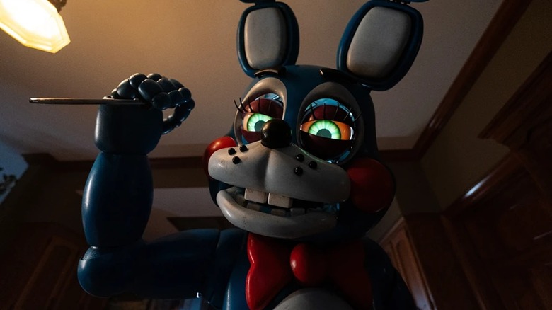 Bonnie holding a weapon in her hand in Five Nights at Freddy's 2