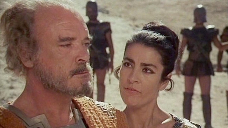 Helen of Troy threatening a soldier in The Trojan Women