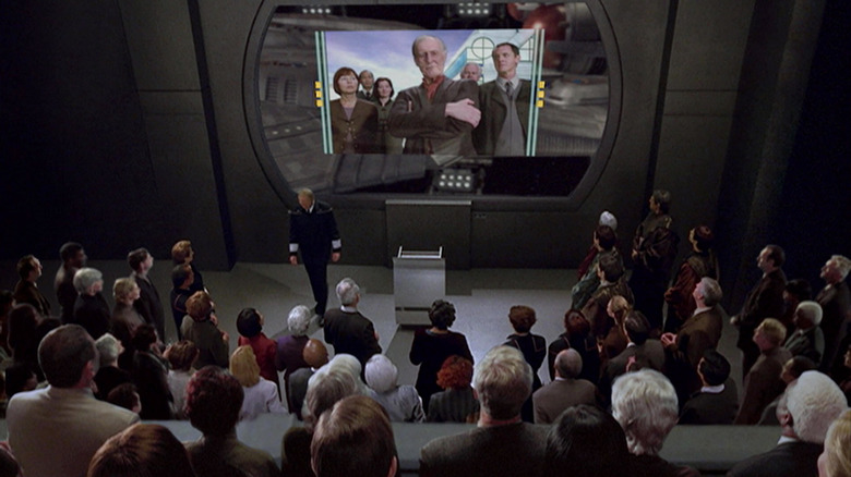 A group of Starfleet officers watching Zefram Cochrane on a screen on Star Trek: Enterprise