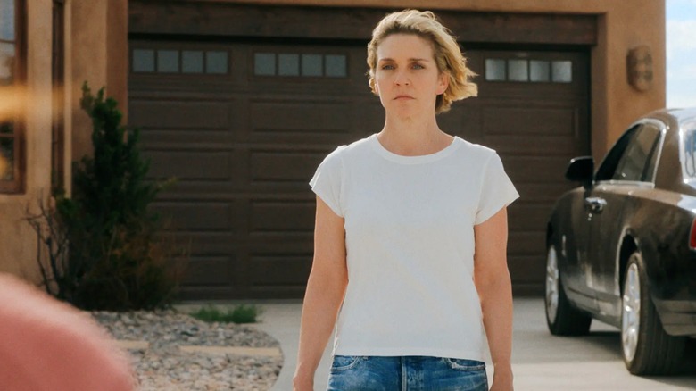 Pluribus - Carol standing in her driveway, looking at offscreen Zosia