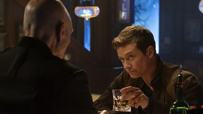 Jean-Luc Picard (Patrick Stewart) shares a drink with Jack Crusher (Ed Speelers) in Star Trek: Picard