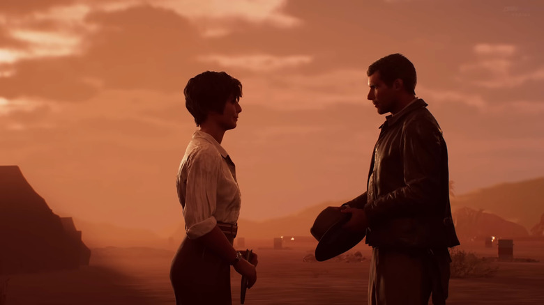 Gina e Indy olham profundamente nos olhos um do outro no pôr do sol em Indiana Jones e no Grande Círculo