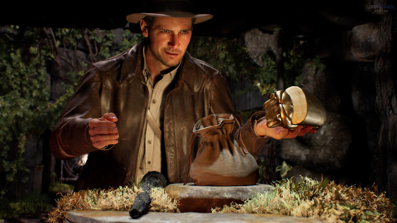 Indiana smirks as he holds the Golden Idol in his hands in Indiana Jones and the Great Circle