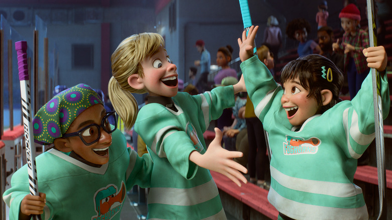 Riley and friends celebrating in the stands after a hockey game in Inside Out 2