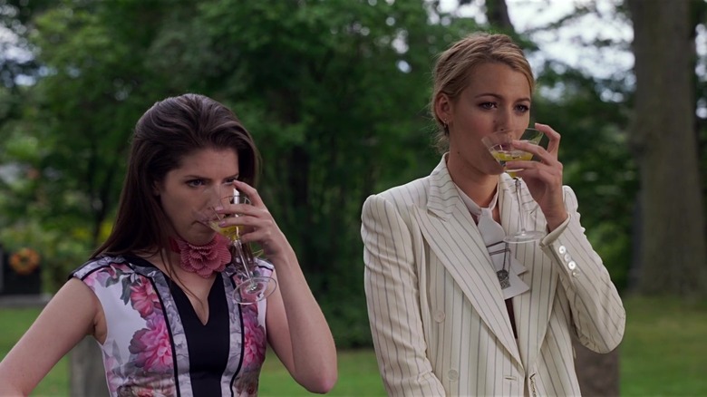 Stephanie and Emily drinking martinis in a graveyard in A Simple Favor