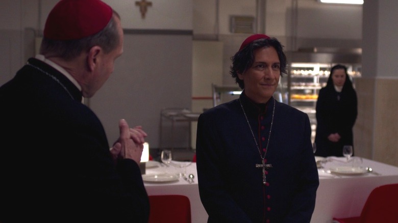Ralph Fiennes as Cardinal Lawrence and Carlos Diehz as Cardinal Benitez in Conclave