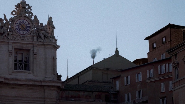 The smoke rising from the chimney signifying whether or not a Pope has been picked in Conclave