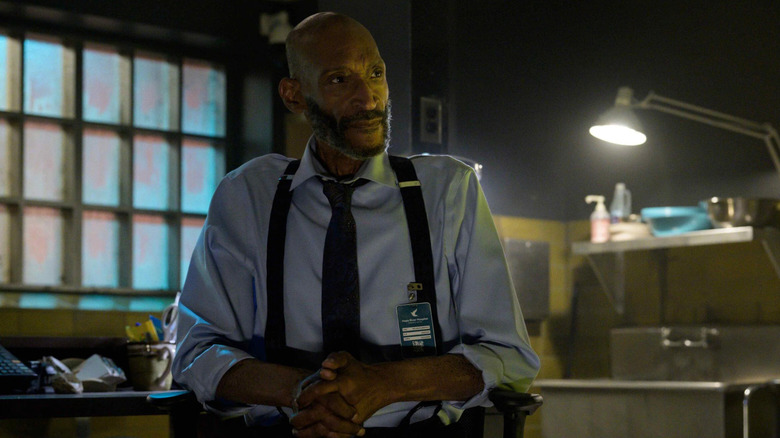 Tony Todd as William Bludworth sitting in a chair in Final Destination Bloodlines