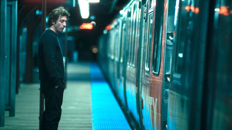 Carmy contemplating stepping on the train in The Bear