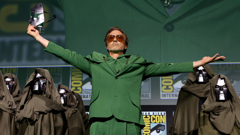 Robert Downey Jr. taking off his Doctor Doom mask on stage at San Diego Comic-Con 2024
