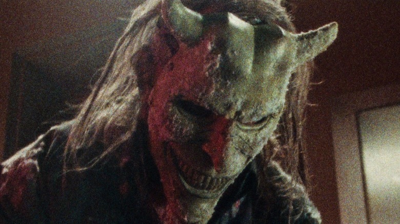 The Grabber looking down in Black Phone 2