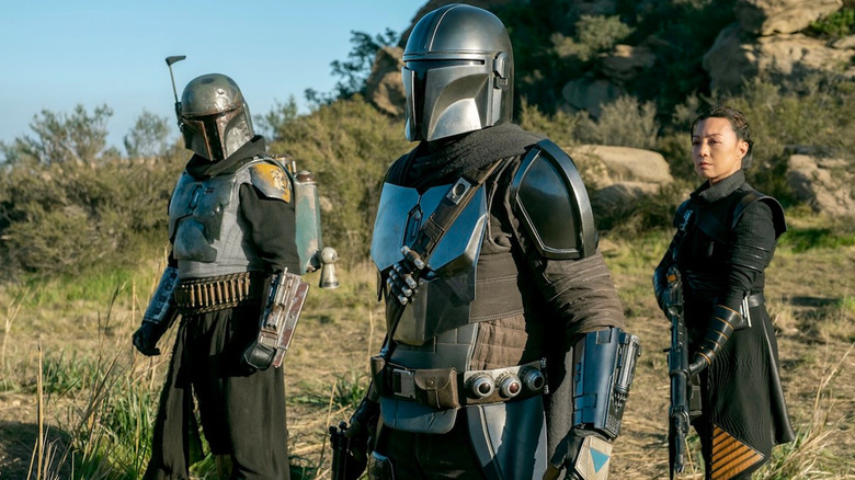 Boba Fett (Temuera Morrison), Din Djarin (Pedro Pascal) and Fennec Shand (Ming-na Wen) in The Mandalorian