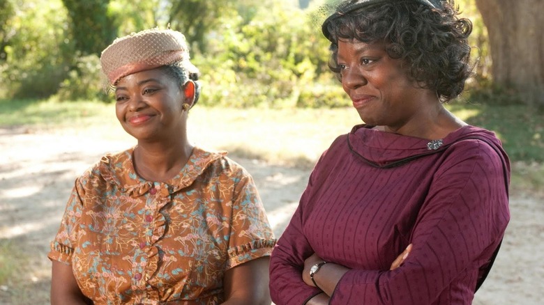 Minny and Aibileen dressed for church and smiling in The Help