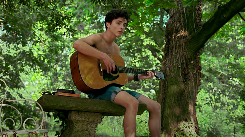 Timothée Chalamet plays the guitar in Call Me by Your Name