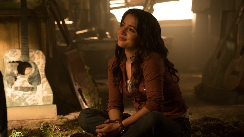 Dina listening to Ellie sing and play guitar offscreen on The Last of Us