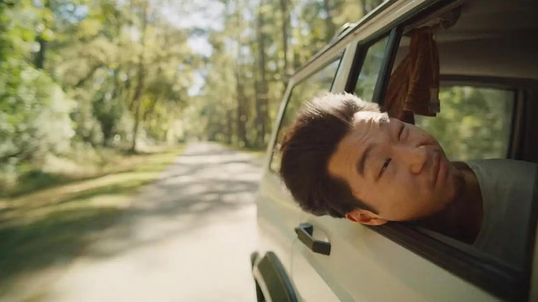 James sticking his head out of a window in It Ends