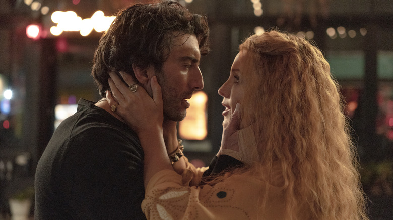 Lily and Ryle grab each other's faces in It Ends With Us