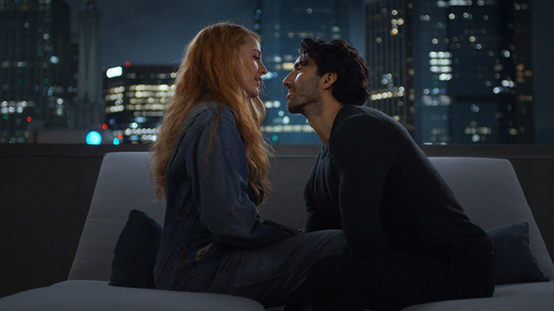 Lily and Ryle on a roof about to kiss in It Ends With Us