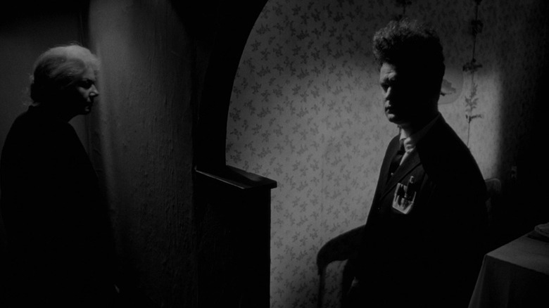 Mrs. X and Henry in a dark house in Eraserhead