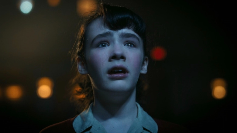 Lilly Bainbridge crying at the movie theater screen in It: Welcome to Derry