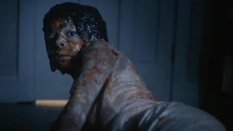 Ronnie is covered in blood and pus after the birth scare in It: Welcome to Derry