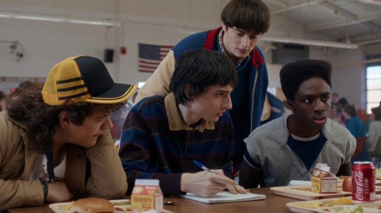 Dustin, Mike, Will, and Lucas in a school cafeteria in Stranger Things season 5