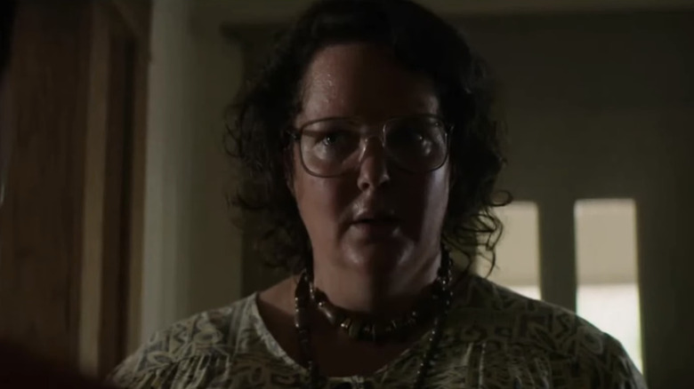 Molly Atkinson as Sonia Kaspbrak is seen in closeup as she stands in the hallway of her home in It