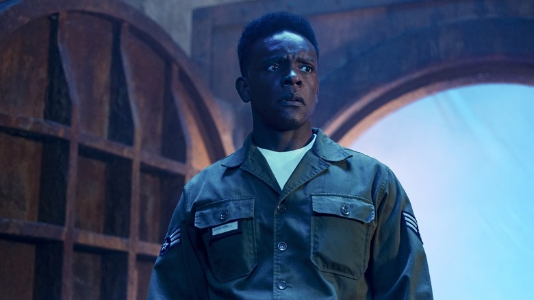 Chris Chalk as Dick Hallorann wearing a military uniform and looking nervous on It: Welcome to Derry