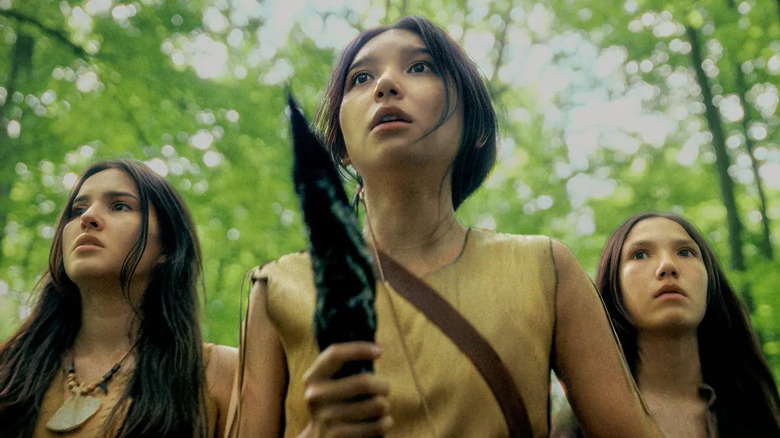Three Shokopiwah youngsters stand in the woods looking frightened in Welcome to Derry: A Story of Derry