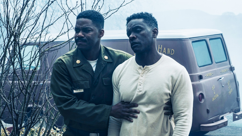 Jovan Adepo's Leroy Hanlon helps Chris Chalk's Dick Hallorann walk in It Welcome to Derry