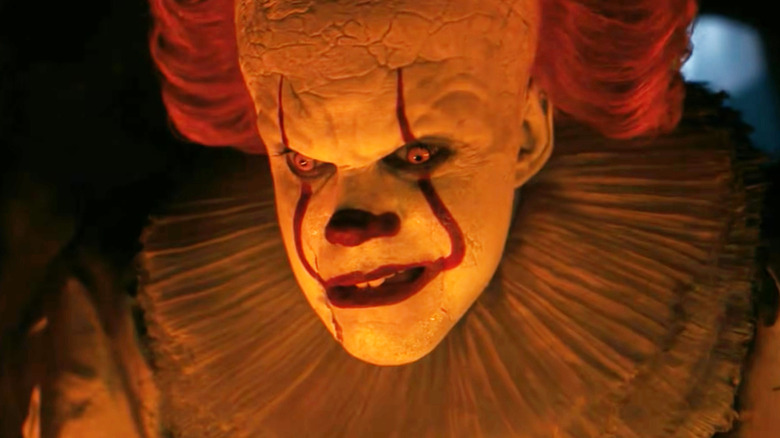 Bill Skarsgård as Pennywise looking angry in It: Welcome to Derry
