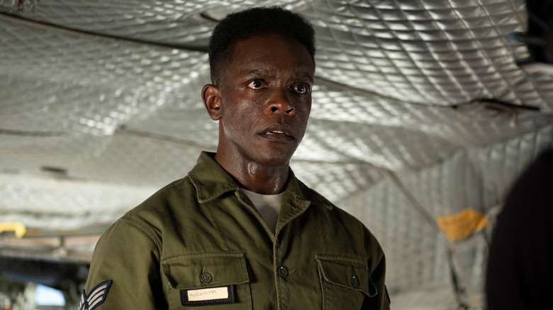 Chris Chalk's Dick Hallorann is seen in standing in a military plane wearing a uniform in It Welcome to Derry.jpg.jpg