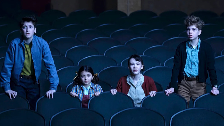 Phil, Susie, Lilly and Teddy have a bad movie theater experience in It: Welcome to Derry