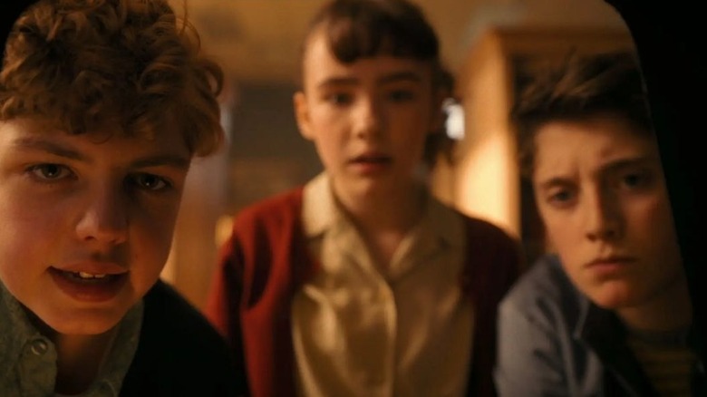 Teddy, Lilly, and Phil investigate in It: Welcome to Derry