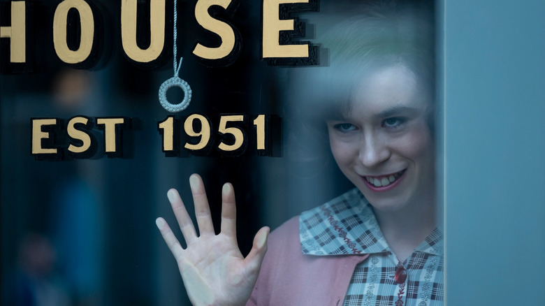 Pennywise as a young woman grinning evilly in It: Welcome to Derry