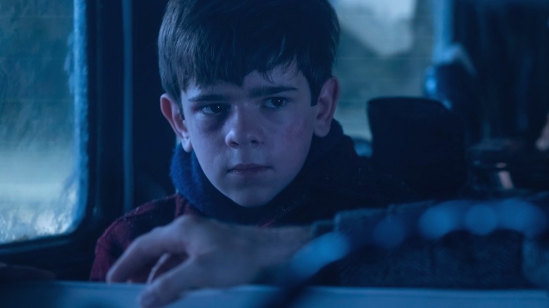 Matty speaks to the people who give him a lift in It: Welcome to Derry