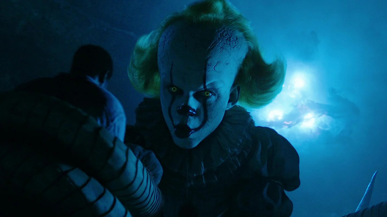 A giant Pennywise attacks Mike Hanlon in It Chapter Two