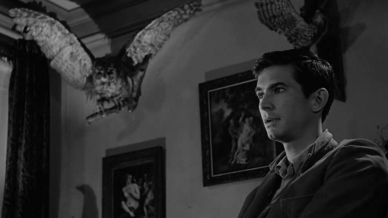 Norman sitting in a parlor in "Psycho"
