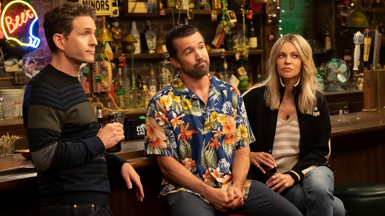 Dennis, Mac and Dee sitting at a bar in It's Always Sunny in Philadelphia