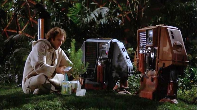 Bruce Dern as Freeman Lowell confers with droids Huey and Dewey in Silent Running