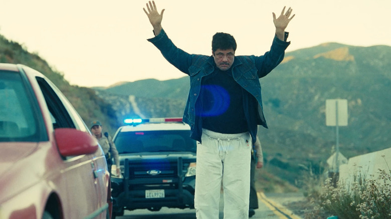 Sensei Sergio dance-walking in front of the cops in One Battle After Another