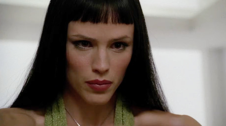 Sydney wearing a black wig and concentrating intensely in Alias