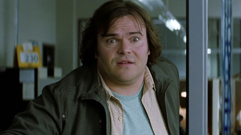 Jack Black wearing a jacket, dress shirt and t-shirt