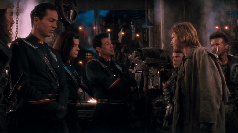 Sylvester Stallone's John Spartan faces Denis Leary's Edgar Friendly in Demolition Man.jpg