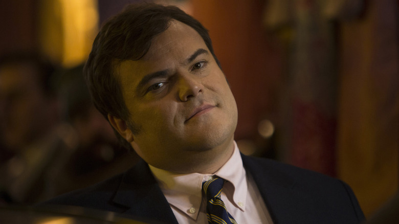 Jack Black as Alex Talbot looking bemused in The Brink
