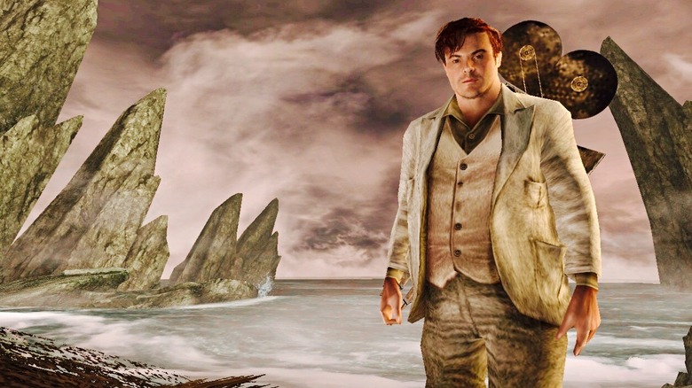 Karl Dunham (Jack Black) stands beside the skull island in the King Kong 2005 video game